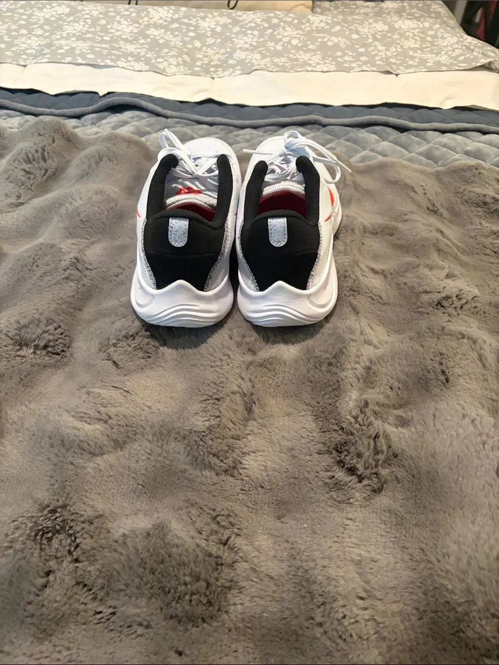 Nike Kids White Sneakers with Red Swoosh and Black Heel